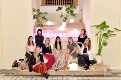 Prior to the inaugural Girlboss Rally in Los Angeles in March, Girlboss and American Express invited a select group of tastemakers to a feminine but edgy dinner, where spherical lighting fixtures and their cords, plus a branded neon sign, were among the design elements.