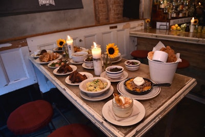 Dishes served at the pop-up—which were provided by Sweet Chick—included chicken and waffles, meatloaf, a fried chicken bucket, potato salad, banana pudding, and peach cobbler.