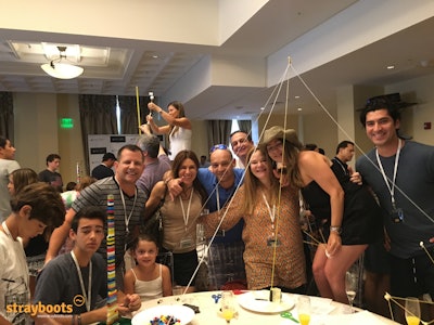 Building the highest Marshmallow tower in a fun team building challenge.