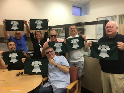 A team from M&T Bank celebrating at the end of their custom scavenger hunt.