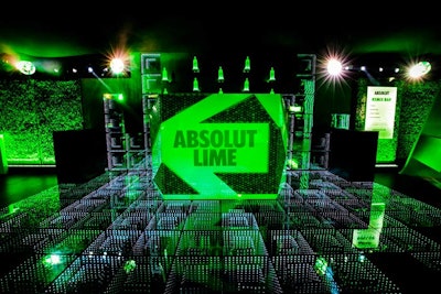 The vibrant green Absolut Limelight tent included an interactive dance floor, a lush lime tree, and a lot of glowing neon signage.