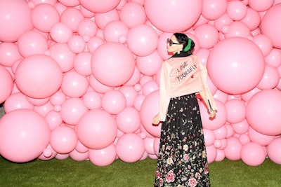 The press wall took the form of a massive collage of pink bubbles.