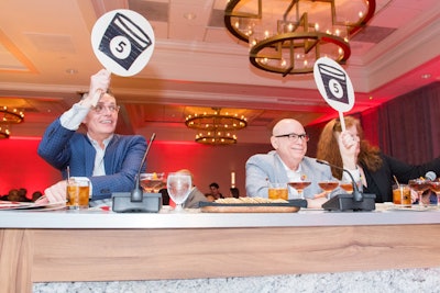 The judging panel, which also included Addison and food writer David Hagedorn, included on-theme score signs.