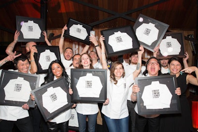 This year's group of Best New Chefs, pictured with Food & Wine editor in chief Nilou Motamed, posed with their framed mini chef's whites.