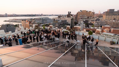 Cocktail hour on the roof with uptown and Hudson River views.