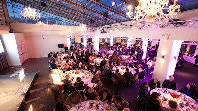 Dinner reception without dance floor and with stage and up-lighting.