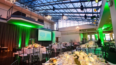 Dinner reception without dance floor and with stage, projection and up-lighting.
