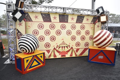 Vintage props and decor included giant polka-dot balls and trunks, flanking strategic areas such as the media wall to create points of interest.