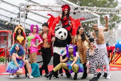 For the circus-theme night, roving entertainers included a fire-eating and boa constrictor contortionist, plus a stilt walker. Dancers were made up with exaggerated costuming and hair styling to give them a mad look, and a circus ringleader and a costumed panda greeted guests as they entered the venue.