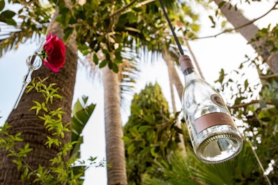 Bottles served as understated—and on-brand—decor, strung from tree branches.