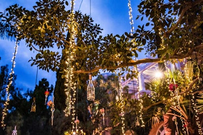 Tree branches in the Beverly Hills Hotel's Crystal Garden were strung with white lights, accented with an installation of roses and bottles of Kim Crawford Rosé.