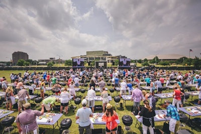 Chef Tim Love led two sessions of his sprawling, hands-on grilling demonstrations. Attendees were stationed at 100 grills, cooking meat according to the chef's directions.