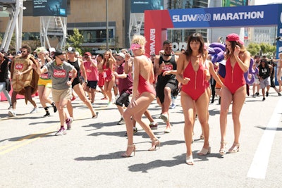 Talent dressed as Baywatch lifeguards helped rally participants to perform their best slow-motion run.