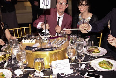 During dinner, guests could play the various instruments on the rotating centerpiece by using sticks placed on the table.
