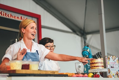 KitchenAid provided all of the equipment for the festival’s two cooking-demonstration tents, such as nonstick pans, mixers, blenders, and even the oven. This allowed the chefs to showcase their culinary skills, including Milk Bar chef Christina Tosi baking and building her famous layered cake.