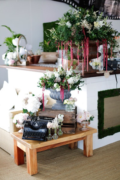 Flowers, including hot-pink threads of wisteria, and a typewriter adorned the space.