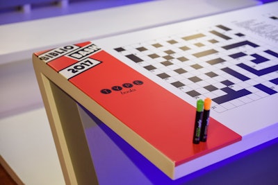 An area sponsored by Type Books featured branded tables with word games including crossword puzzles.
