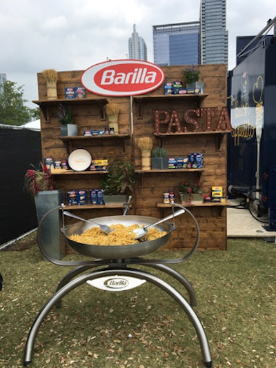 Italian company Barilla brought its pasta-dishing truck to the Austin Food & Wine Festival, which featured seating and a giant noodle-filled pan with oversize utensils for a photo op.