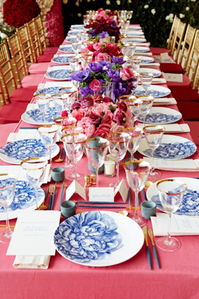 Dinner tables covered in pink, light pink, red, and burgundy cloths featured gold vase centerpieces filled with ranunculus, roses, anemones, and peonies in a nod to honoree Rei Kawakubo's floral-print garments. 'I experimented with the composition of the arrangements, making them looser and more playful,' Ávila said.