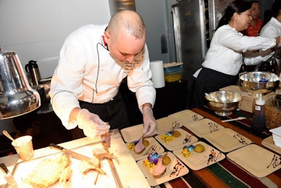 The chef representing Iraq plated each dish of crusted lamb chop with kibbeh and cilantro mechouia lamb jaus garnished with a flower.