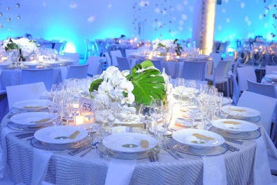 Centerpieces contained white orchids and pops of greenery.