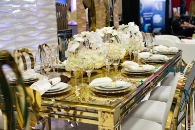 Decora's booth featured furniture and tabletop items in a gold and white palette.