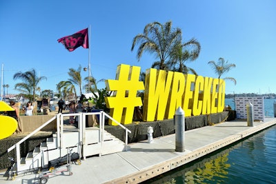 The island displays the #wrecked hashtag in a prominent way; it also lights up at night to serve as a floating billboard. A TBS-branded flag flies overhead.