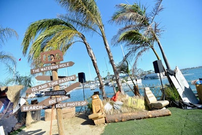 Tongue-in-cheek signage leads guests around the island, showing the way to “The Watering Hole” (the bar) and “Island Time Passers” (mini golf and Skee-Ball stations).