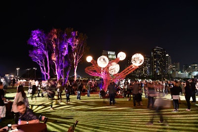 The event featured a fire art sculpture in the shape of a tree by artist Charles Gadeken.