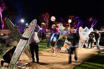 Attendees painted surfboards at the Max Bash.