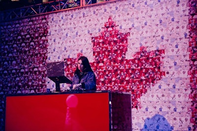 A second Canadian flag mosaic wall served as a backdrop for DJ Sophie Jones, who performed at a booth on the field.