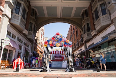 A colorful entrance to the Fashion Carnival set the tone for the event's theme.