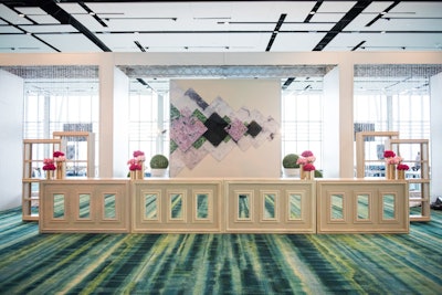 Hello Washington, DC! created a custom room-divider to separate the RiverView Ballroom at the Gaylord National Resort and Convention Center into two spaces. The bar backdrop tied in the cherry blossoms of the region into the design.