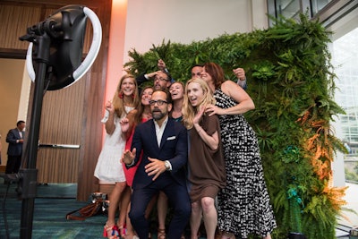 Guests including Philip Dufour and team could pose in front of a live greens photo backdrop by Brightly Ever After and photo booth from Ticked Photobooth.