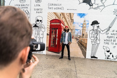 Tinder and Delta hosted a singles-centric event June 17, at which guests could pose for a photo, taken by a professional photographer, in front of a branded wall.