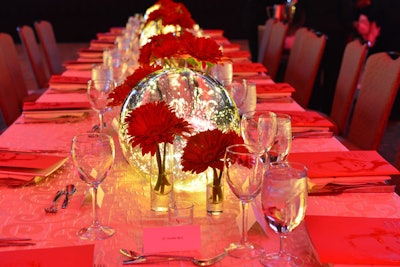 Tables in the dining ballroom featured 12-inch, battery-lit mercury globes inspired by Ross's trips around the world.