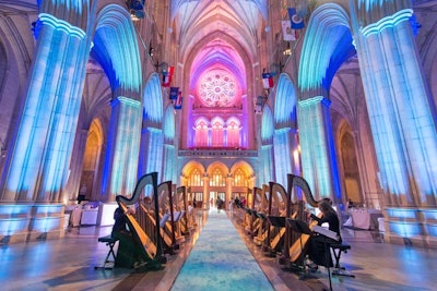 Twelve harpists from the American YouthHarp Ensemble lined the teal-carpeted entrance leading guests into the cathedral for dinner.