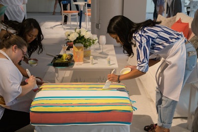 Guests also had the chance to paint on ottomans, duvets, rugs, lampshades, and other household items.