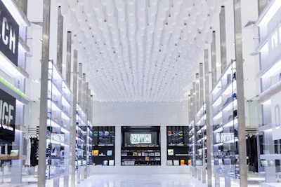 A hanging installation of 650 all-white replicas of Nike’s Jordan II sneakers takes center stage at Kith’s flagship store in Brooklyn.