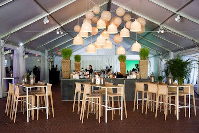 Woven lampshades above the central bar and greenery throughout the space created a natural feel befitting the park setting.