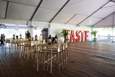 Marquee letters spelling 'Taste' at the entrance created a natural spot for photos.