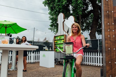 At each event, guests can mix their own cocktails by pedaling a bike that powers a blender.