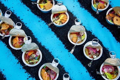 Chef Joachim Splichal from Los Angeles served up cleverly plated contemporary niçoise salad in a can, which sat atop strips of dirt as a nod to his winery.