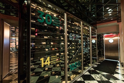 In the entryway to a lounge celebrating all of the brands, statistics about Marriott were displayed on mirrors surrounding a wine room.