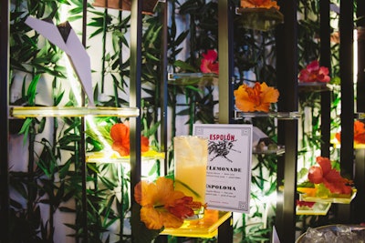 A wall of bamboo, flowers, and paper planes behind the bar was designed by Sa’Diyya Dunkley of Hermosa Design House. The colorful backdrop was a nod to the cover of Carter's album Flowers and Planes.