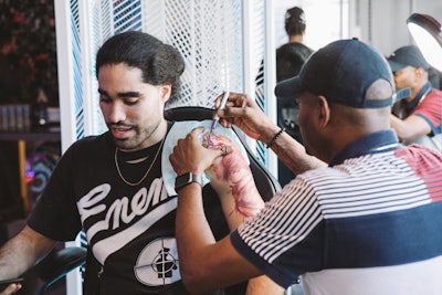At the kickoff event, Tuki Carter designed tattoos in real-time for guests who made appointments in advance.