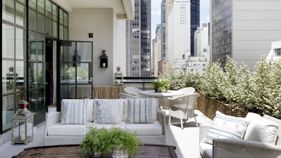 Doors lead onto two sweeping terraces with stunning views of New York, spanning both sides of the hotel.