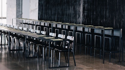 Conference Seating featuring black Bellini chairs, Judd Tables, Paramount Barstools, and Runner Tables.