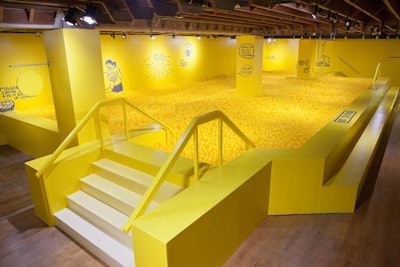A room filled with 207,000 yellow balls has fun and inspirational sayings written on the walls, such as “Celine Dijon” and “There are nice people all around you.”