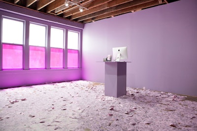 In a lavender room created by artist Tom Stayte, a printer prints thousands of selfies sourced from the Internet every 12 seconds.